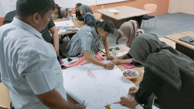 Participants working together during a practical group activity