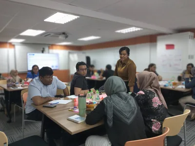 A facilitator guiding participants during an interactive workshop